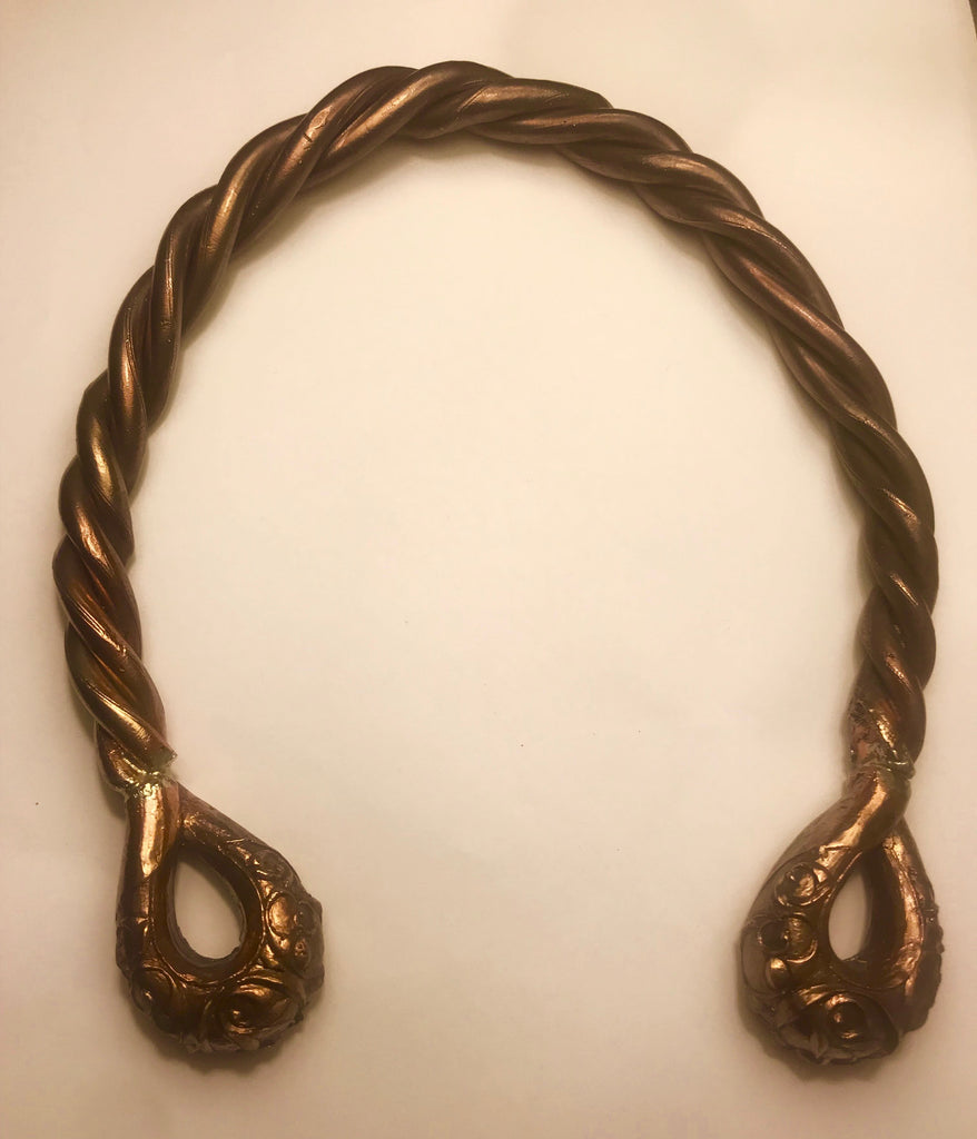 The Great Torc from Snettisham, England, 1st century BC, made with just  over a kilogram of gold mixed with silver. The Celtic torc, or neck ring,  is one of the most complex